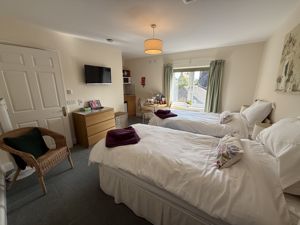 Guest suite bedroom/kitchenette- click for photo gallery